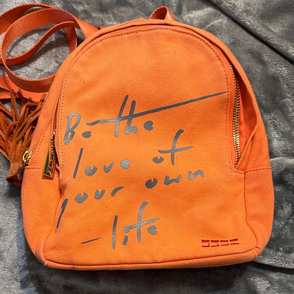 Peace Love World Orange Backpack with Inspirational Text